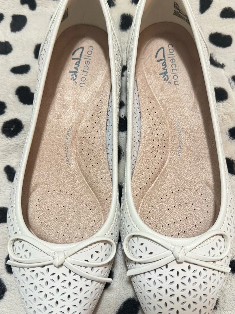 Comfortiva White Laser-Cut Bow Ballet Flats